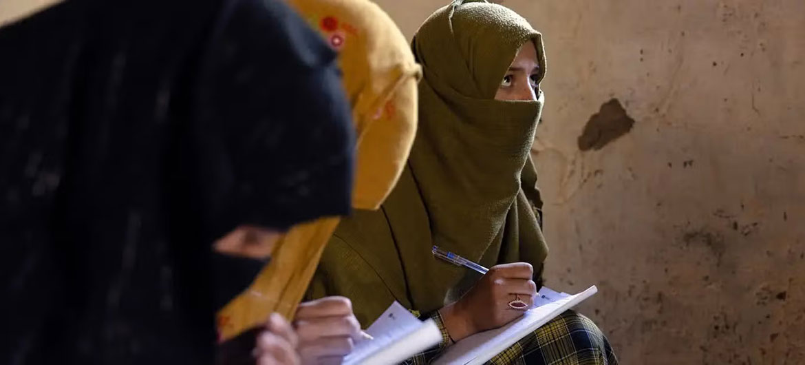 Women learn to read and write through a literacy initiative supported by UN Women, in Nuristan province, eastern Afghanistan.