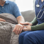 A home health nurse making a home visit.